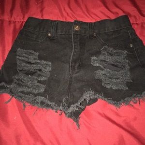 Short ripped in front jeans.
